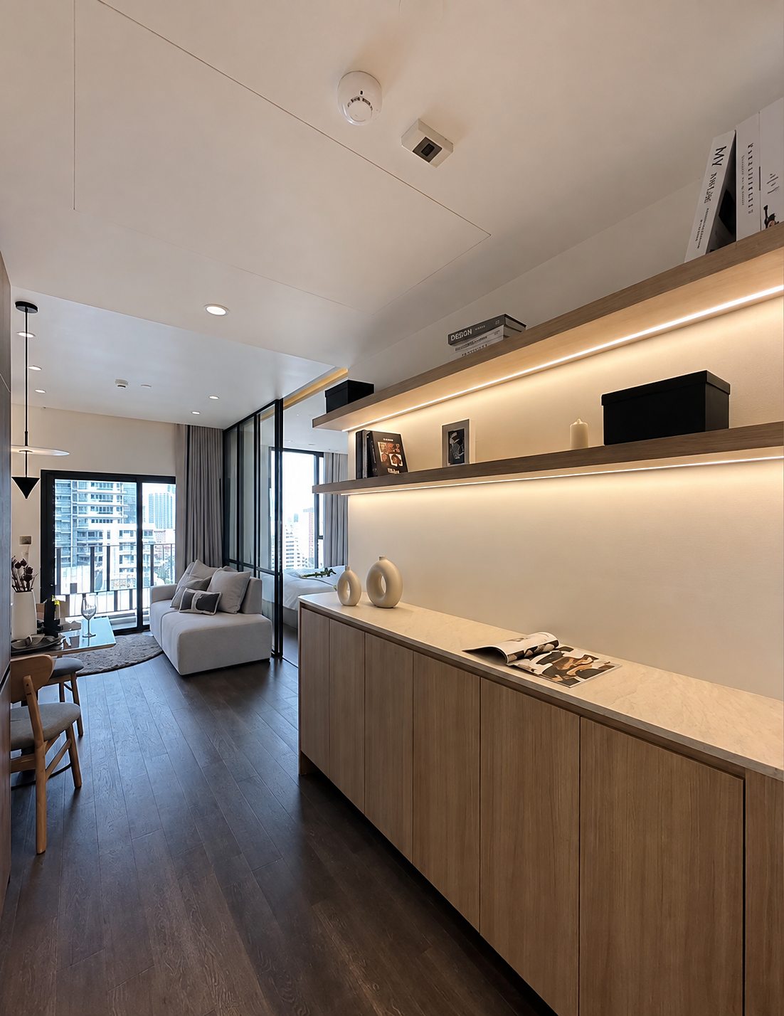 MUNIQ Sukhumvit 23: Kitchen counter and living area