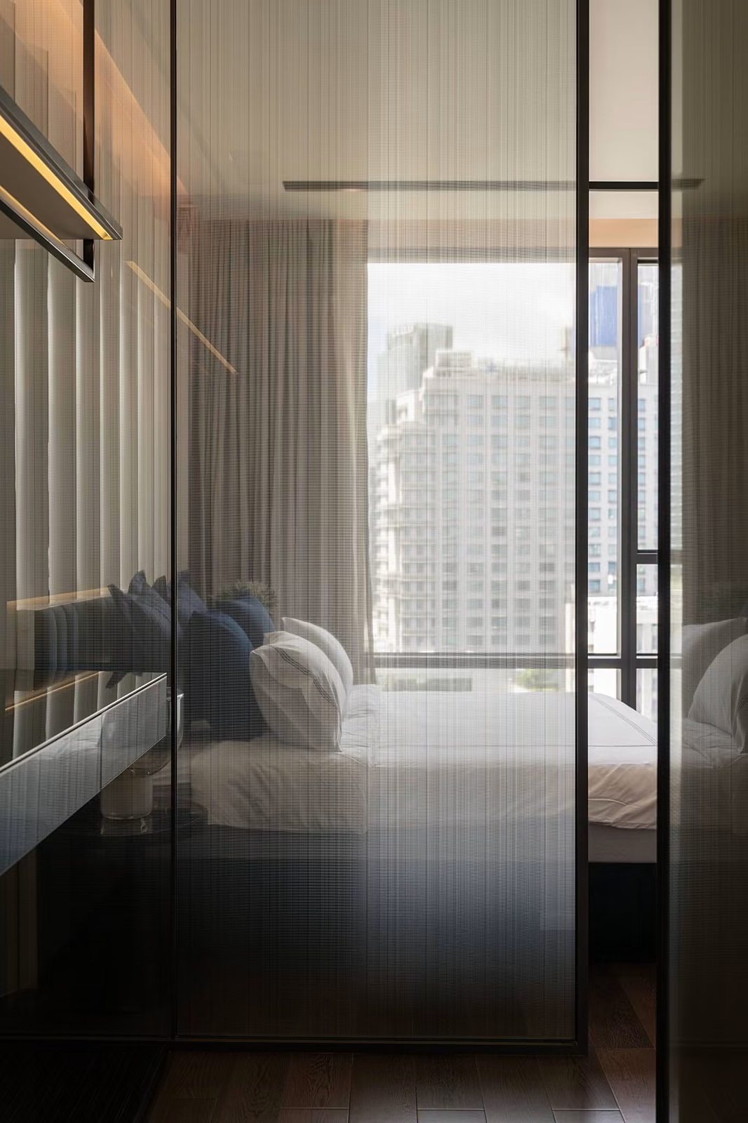 The Bangkok Thonglor: Bedroom through glass